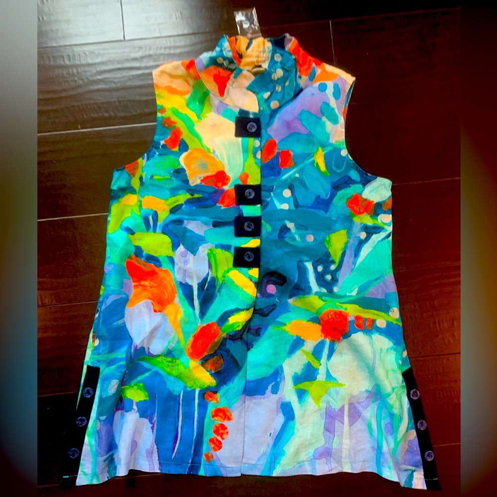 Collarless tunic length blouse with button front and decorative side buttons